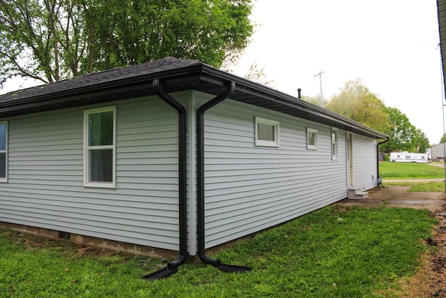 view of property exterior featuring a yard