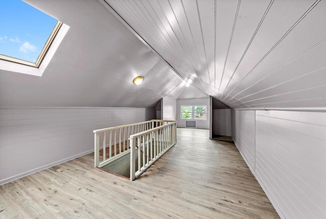 1306 Highland Ave, Berwyn, IL 60402 - bonus room featuring wood finished floors, vaulted ceiling, a skylight, and wooden walls