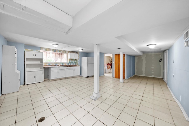 1306 Highland Ave, Berwyn, IL 60402 - kitchen with freestanding refrigerator, white cabinetry, light tile patterned floors, and open floor plan