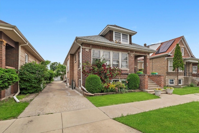 1306 Highland Ave, Berwyn, IL 60402 - bungalow featuring brick siding and a front yard