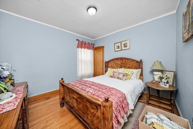 1306 Highland Ave, Berwyn, IL 60402 - bedroom featuring ornamental molding and light wood-style flooring