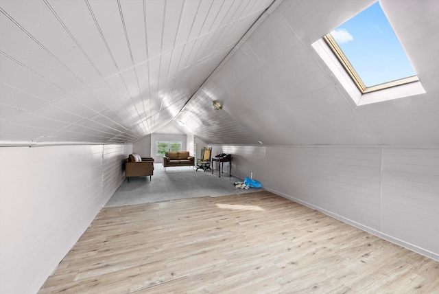 1306 Highland Ave, Berwyn, IL 60402 - additional living space featuring a skylight, wood finished floors, and vaulted ceiling