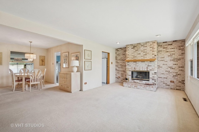 8223 N Washington St, Niles, IL 60714 - living room featuring a chandelier, carpet flooring, and a fireplace