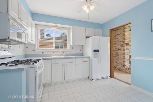 8223 N Washington St, Niles, IL 60714 - kitchen featuring white appliances, a sink, white cabinets, ceiling fan, and light countertops