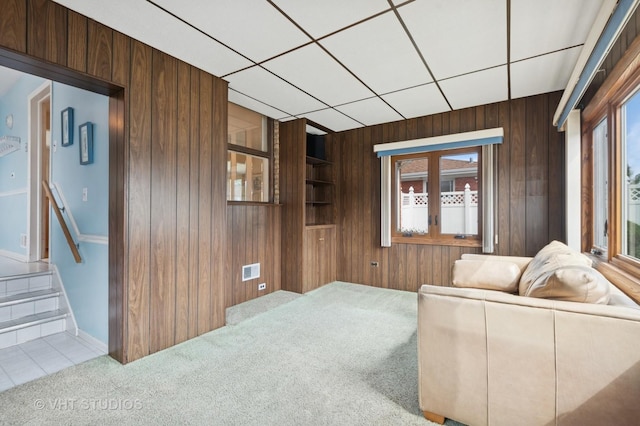 8223 N Washington St, Niles, IL 60714 - living room with wooden walls, carpet floors, tile patterned floors, and baseboards