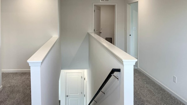 staircase with carpet, baseboards, and visible vents