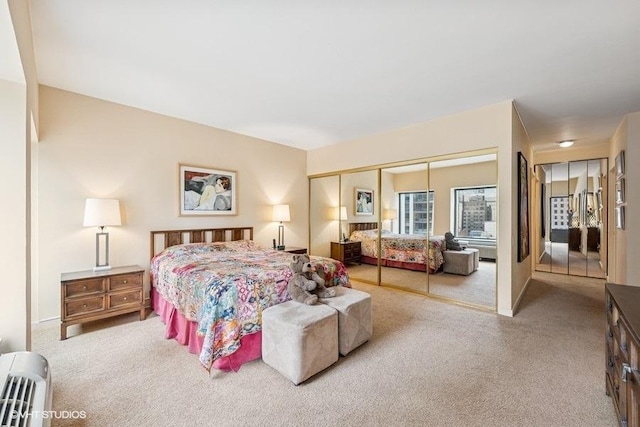 carpeted bedroom featuring a closet