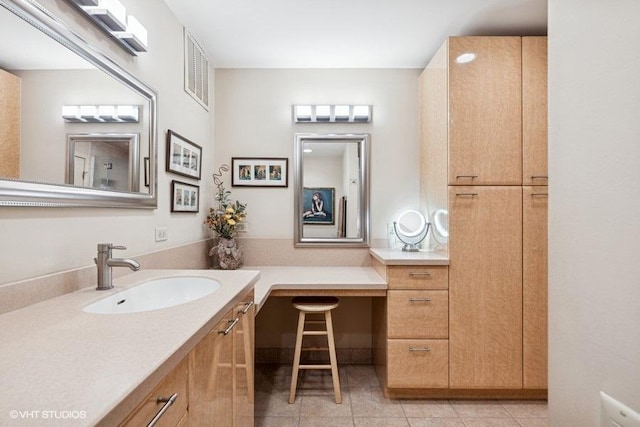 bathroom with tile patterned flooring, vanity, and visible vents