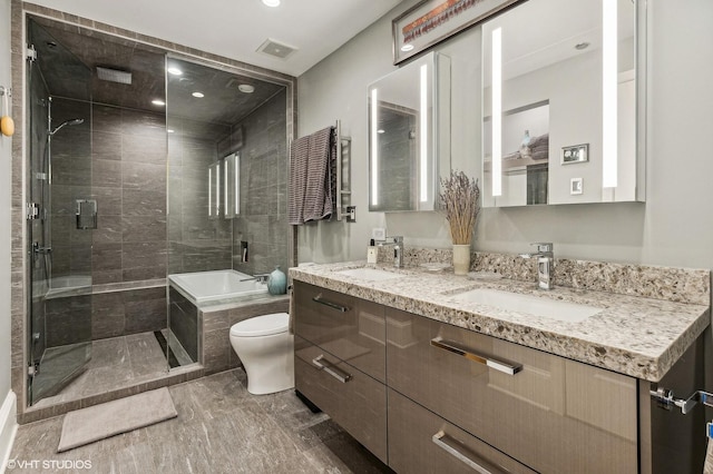 900 N Kingsbury St Unit 1150, Chicago, IL 60610 - bathroom with tiled shower, toilet, recessed lighting, double vanity, and tiled bath