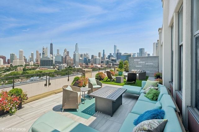900 N Kingsbury St Unit 1150, Chicago, IL 60610 - view of patio with an outdoor living space, a skyline view, and a balcony