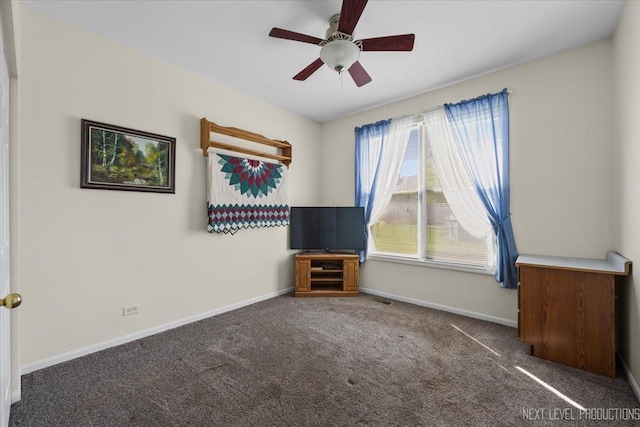 unfurnished bedroom featuring carpet flooring, baseboards, and ceiling fan