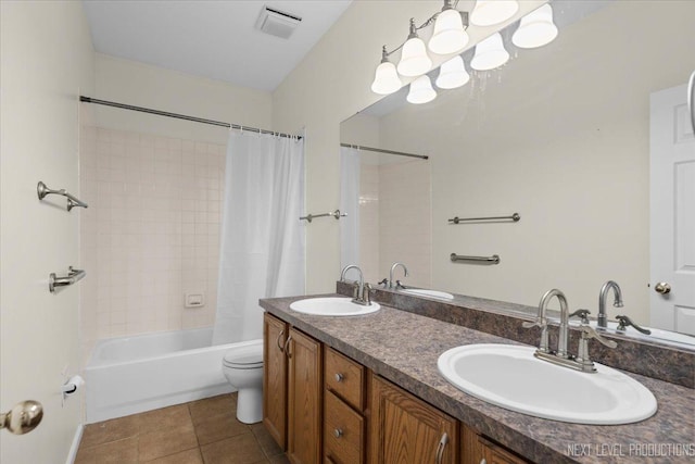 bathroom featuring tile patterned flooring, toilet, shower / bath combo with shower curtain, and double vanity