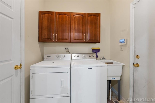 laundry area with cabinet space and washing machine and clothes dryer