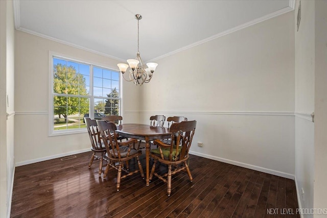 dining space featuring a chandelier, crown molding, baseboards, and wood-type flooring