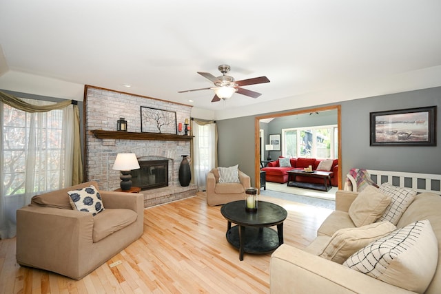1408 Ambleside Cir, Naperville, IL 60540 - living room with wood finished floors, a ceiling fan, and a fireplace