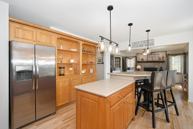 1408 Ambleside Cir, Naperville, IL 60540 - kitchen with stainless steel fridge with ice dispenser, a center island, light wood-type flooring, light countertops, and open floor plan
