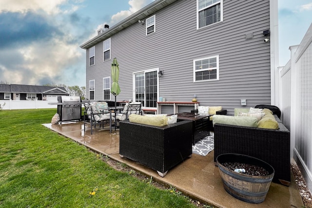 back of house with fence, a patio, outdoor lounge area, and a lawn