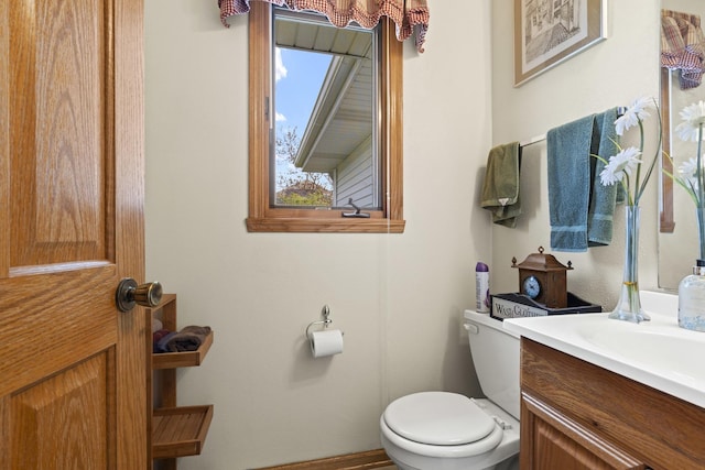 11920 Hunterston Dr, Caledonia, IL 61011 - half bathroom with vanity, toilet, and baseboards