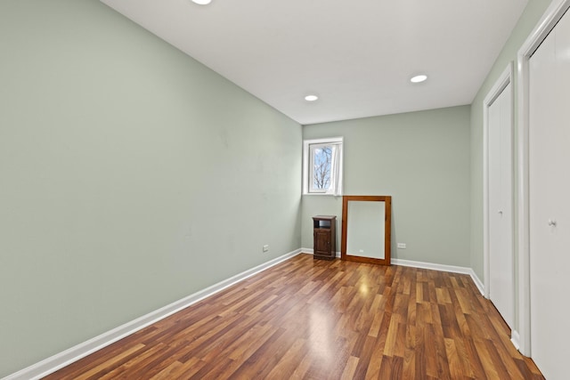 11920 Hunterston Dr, Caledonia, IL 61011 - unfurnished bedroom with baseboards, a closet, recessed lighting, and wood finished floors