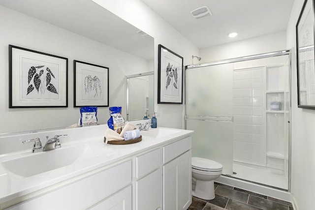 6600 Linden Trl Unit F, Wonder Lake, IL 60097 - full bathroom featuring a shower stall, toilet, visible vents, and a sink