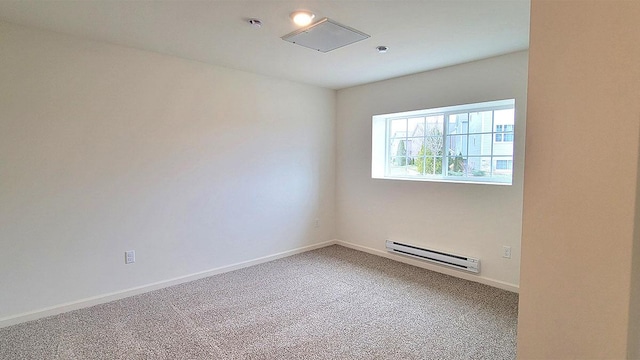 6600 Linden Trl Unit F, Wonder Lake, IL 60097 - spare room with a baseboard heating unit, baseboards, and carpet floors