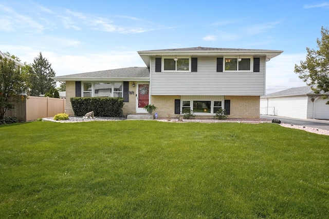 tri-level home featuring brick siding