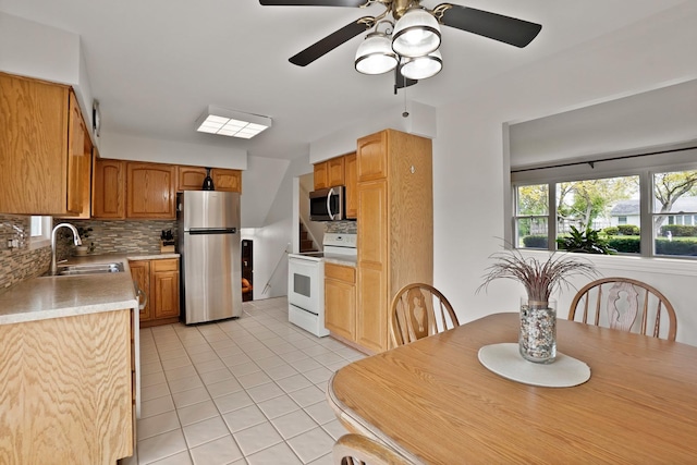 dining area featuring light tile patterned floors and a ceiling fan