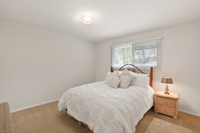 carpeted bedroom with baseboards