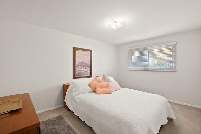 bedroom with carpet flooring and baseboards