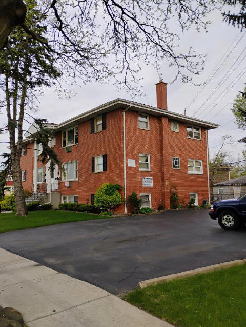8856 Plainfield Rd, Brookfield, IL 60513 - view of side of home with brick siding and a chimney