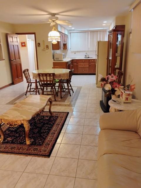 8856 Plainfield Rd, Brookfield, IL 60513 - living area featuring a ceiling fan and light tile patterned flooring