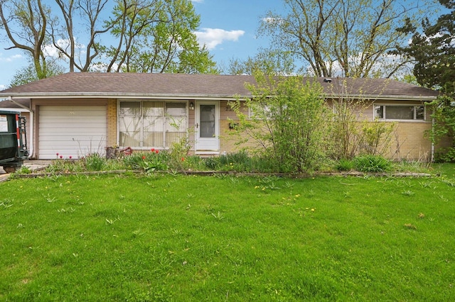 ranch-style house featuring an attached garage, a front lawn, and brick siding