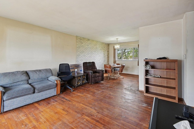 living room featuring a notable chandelier and wood finished floors
