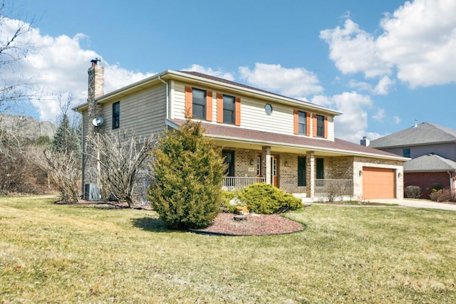 traditional home with a chimney, covered porch, a front lawn, and an attached garage