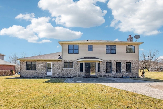 view of front of house featuring a chimney, a front yard, and entry steps