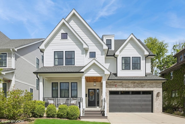 443 N Spring Ave, La Grange Park, IL 60526 - view of front facade featuring a shingled roof, covered porch, driveway, a garage, and brick siding