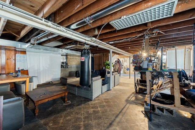 unfinished below grade area featuring a workshop area