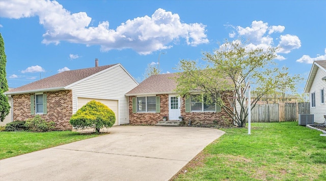 bungalow with concrete driveway, brick siding, fence, and a garage