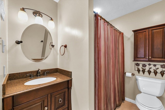bathroom featuring toilet, vanity, a textured ceiling, and a shower with shower curtain