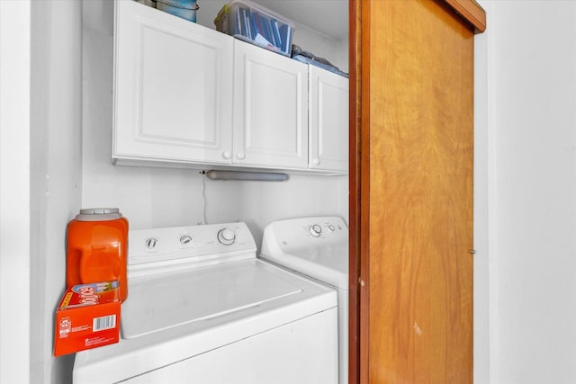 laundry room featuring cabinet space and washer and dryer