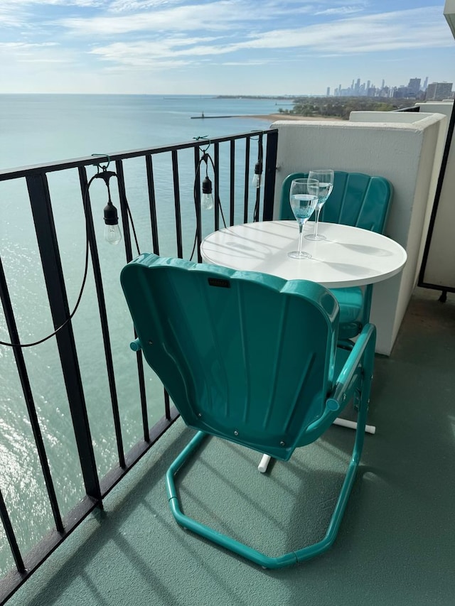 balcony featuring a water view