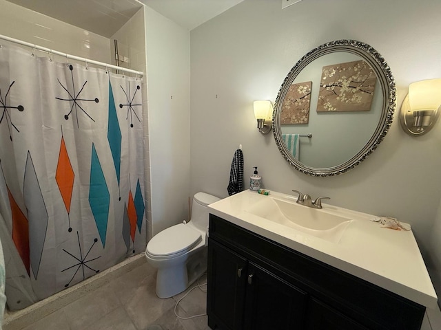 bathroom featuring toilet, tile patterned floors, vanity, and curtained shower