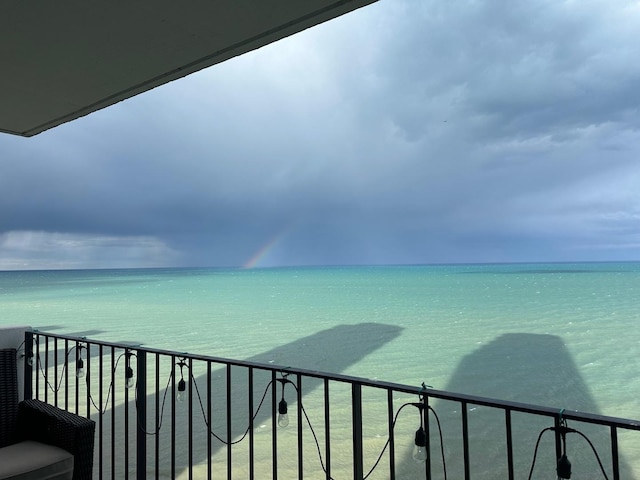 balcony featuring a water view