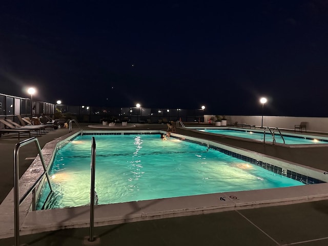 pool at twilight with a community pool