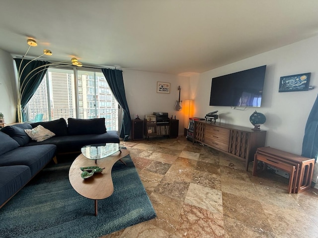 living area with stone tile floors