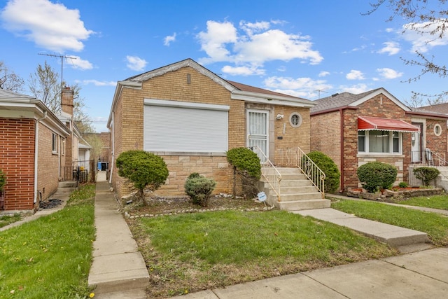 10129 S Indiana Ave, Chicago, IL 60628 - bungalow-style home featuring a front yard and brick siding