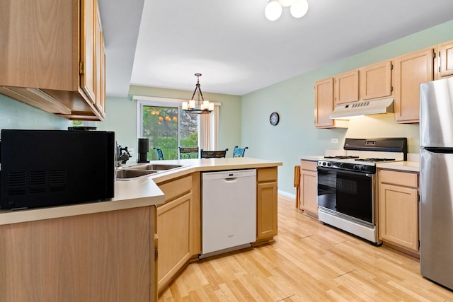 1277 Silk Oak Ln, Bartlett, IL 60103 - kitchen with white dishwasher, range with gas stovetop, under cabinet range hood, and light brown cabinetry