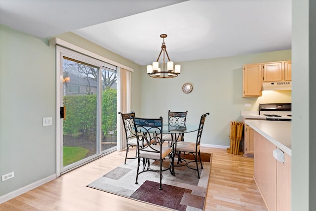 1277 Silk Oak Ln, Bartlett, IL 60103 - dining space featuring light wood-style floors, a chandelier, and baseboards