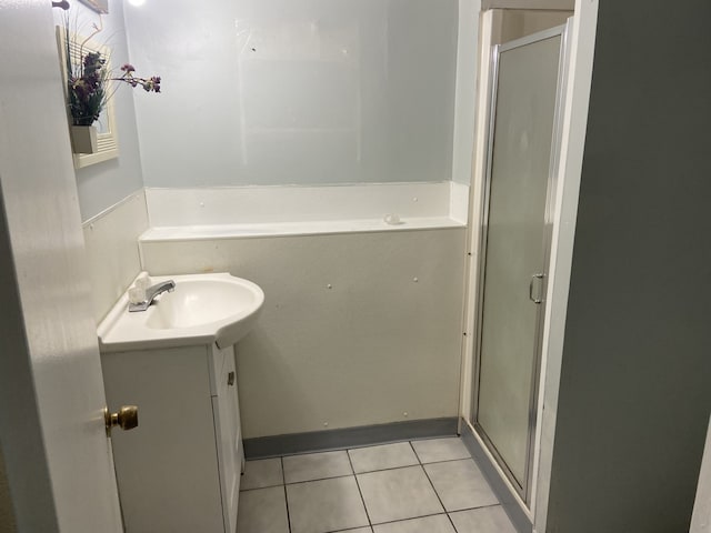 5014 W Strong St, Chicago, IL 60630 - bathroom featuring tile patterned flooring, a shower stall, and vanity