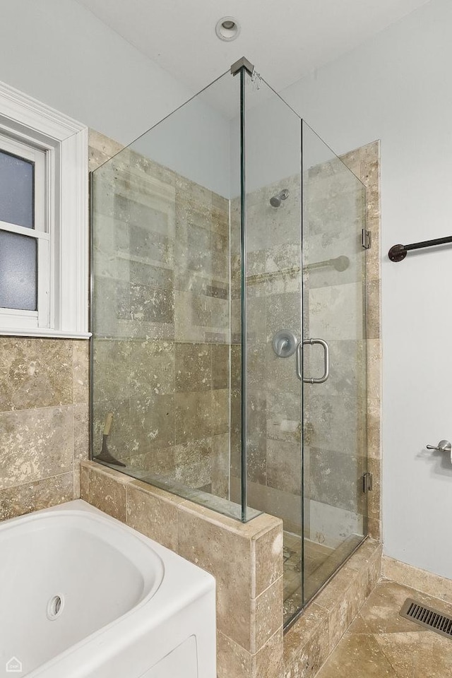 4843 N Harding Ave Unit 1N, Chicago, IL 60625 - bathroom featuring a tub with jets and a shower stall